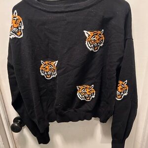 Dressed in Lala, cropped, tiger sweatshirt. Used-fair condition.